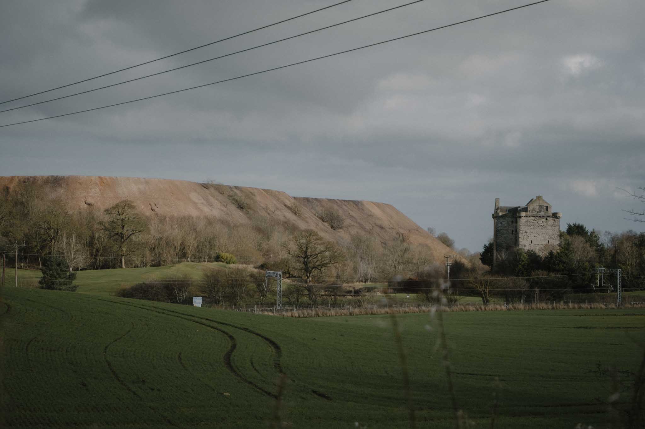 Niddry castle and shale bing